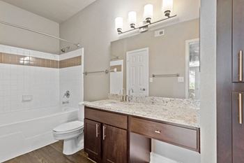 a bathroom with a toilet sink and bathtub at The Verandah, Austin, Texas